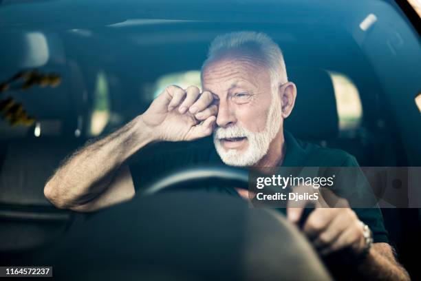 senior man almost falls asleep while driving. - stroke illness stock pictures, royalty-free photos & images