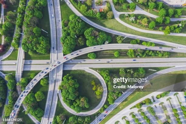 aerial view of road junction - straßenüberführung stock-fotos und bilder