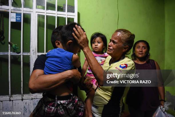 America del Carmen Gomez caresses her grandson, son of Xochitl Nayeli Irineo Gomez who was one of the victims of the attack at the Caballo Blanco...