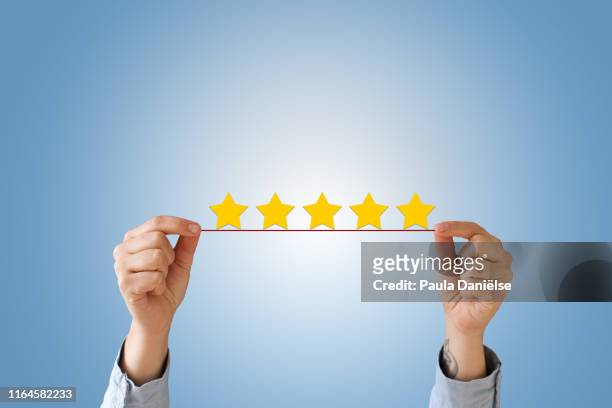 5 star review - soddisfazione foto e immagini stock