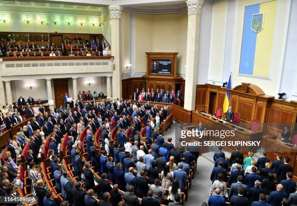 Lawmakers take the oath during the solemn opening and first sitting of the new parliament, the Verkhovna Rada, in Kiev on August 29, 2019. -...