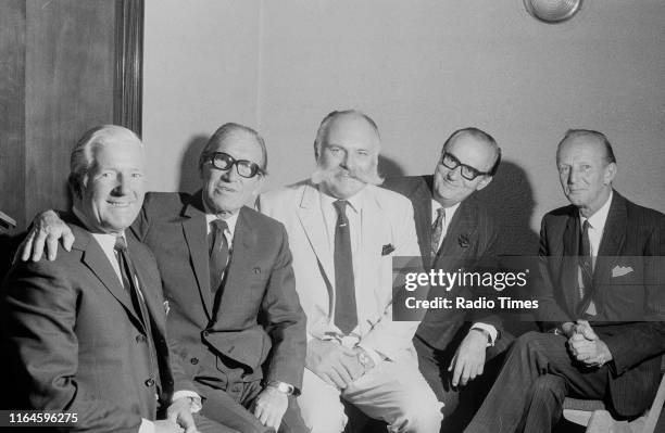 Comedians Ted Ray, Arthur Askey, Jimmy Edwards, Cyril Fletcher and McDonald Hobley pictured together during a recording for the BBC Radio 4 comedy...