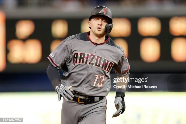 Nick Ahmed of the Arizona Diamondbacks rounds the bases after hitting a grand slam in the fourth inning against the Miami Marlins at Marlins Park on...