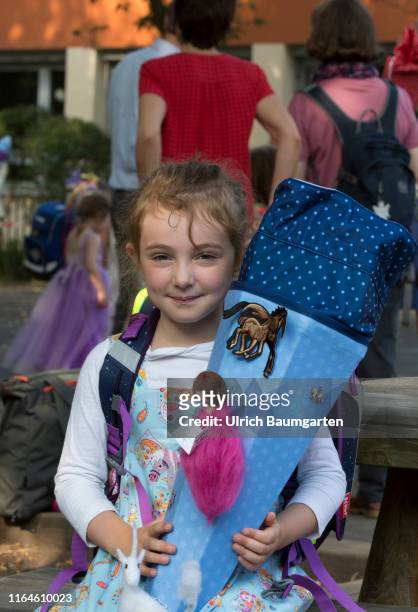 The first day of school in the Donatus elementary school in Bonn and a new step into life - girl with school cone.