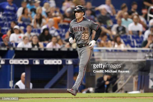 Jake Lamb of the Arizona Diamondbacks rounds the bases after hitting a two-run home run in the sixth inning against the Miami Marlins at Marlins Park...
