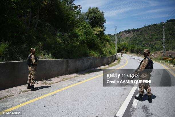 Pakistani troops patrol near the Line of Control --- the de facto border between Pakistan and India -- in Chakothi sector, in Pakistan-administered...