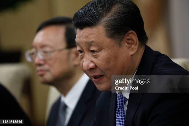 Chinese President Xi Jinping speaks to Philippine President Rodrigo Duterte during their meeting at the Diaoyutai State Guesthouse on August 29, 2019...