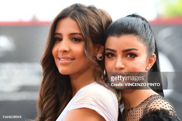 Saudi actress Dhay and Saudi actress Mila Al Zahrani arrive on August 29, 2019 for the screening of the film "The Perfect Candidate" during the 76th...