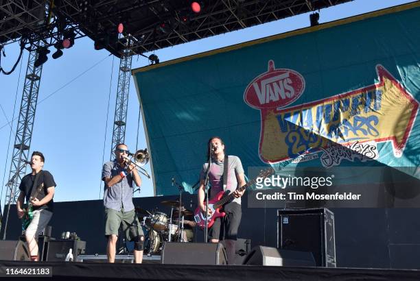Chris DeMakes, Buddy "Goldfinger" Schaub, and Roger Lima of Less than Jake perform during the Vans Warped Tour 25th Anniversary on July 20, 2019 in...