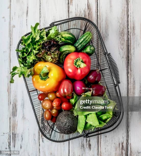 a basket of fresh fruits and vegetables on white background - ingredients on white ストックフォトと画像