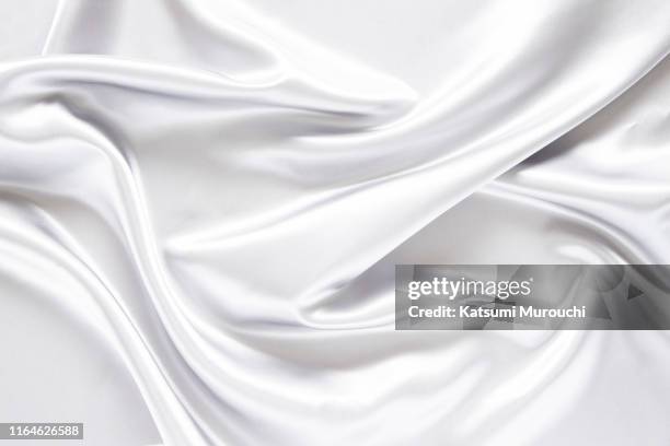 white satin textured background material - soie photos et images de collection