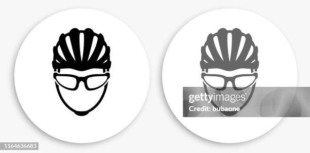 bike helmet black and white round icon - cycling helmet stock illustrations