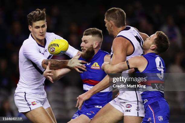 Rory Lobb and Aaron Sandilands of the Dockers compete for the ball against Jackson Trengove and Hayden Crozier of the Bulldogs during the round 19...