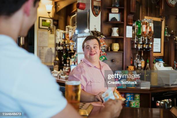 serving drinks in the pub - british pub stock pictures, royalty-free photos & images