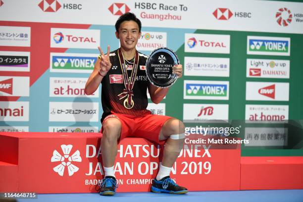 Gold medalist Kento Momota of Japan poses during the medal ceremony of the Men's Singles Final after defeating Jonatan Christie of Indonesia on day...