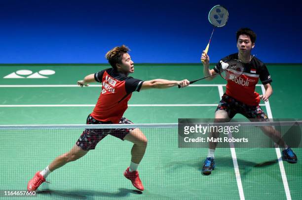 Marcus Fernaldi Gideon and Kevin Sanjaya Sukamuljo of Indonesia compete in the Men's Doubles Final match against Mohammad Ahsan and Hendra Setiawan...