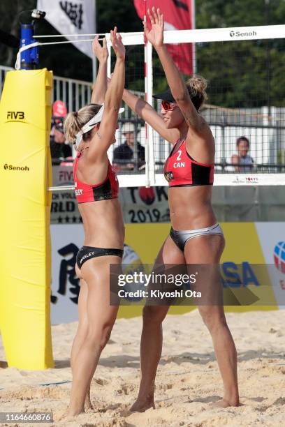 Heather Bansley and Brandie Wilkerson of Canada celebrate after winning the Women’s bronze medal match against Julia Sude and Karla Borger of Germany...