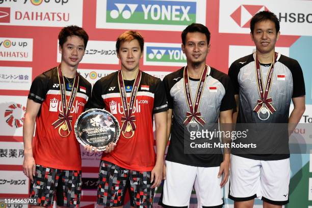 Gold medalists Marcus Fernaldi Gideon and Kevin Sanjaya Sukamuljo of Indonesia and silver medalists Mohammad Ahsan and Hendra Setiawan of Indonesia...