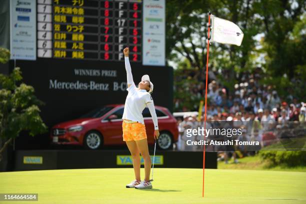 Mone Inami of Japan celebrates the birdie to win the tournament on the 18th green during the final round of the Century 21 Ladies Golf Tournament at...