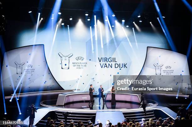 Virgil Van Dijk of Liverpool and the Netherlands comes to the stage after been elected the 2018/19 UEFA Player's of the Year Trophy and best defender...