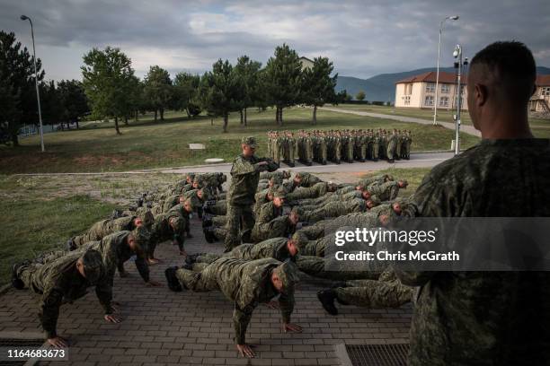 Kosovo Security Forces new basic training recruits do pushups before breakfast during the final weeks of their nine-week basic training on July 25,...