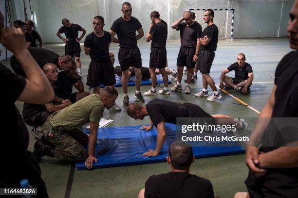 Kosovo Security Forces new basic training recruits take part in fitness challenges during the final weeks of their nine-week basic training on July...
