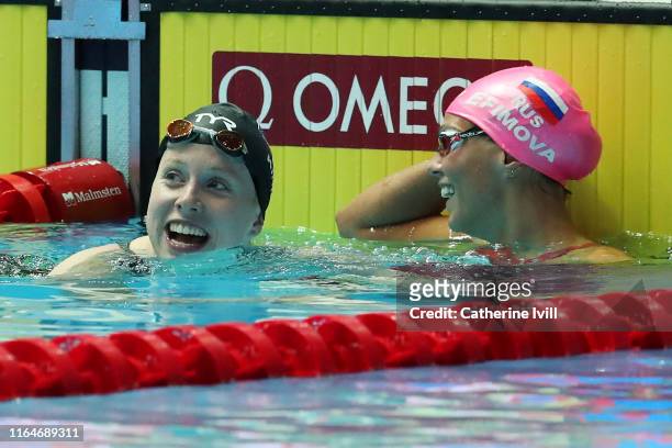 Lilly King of the United States and Yulia Efimova of Russia celebrate winning the gold and bronze respectively after competing in the Women's 50m...