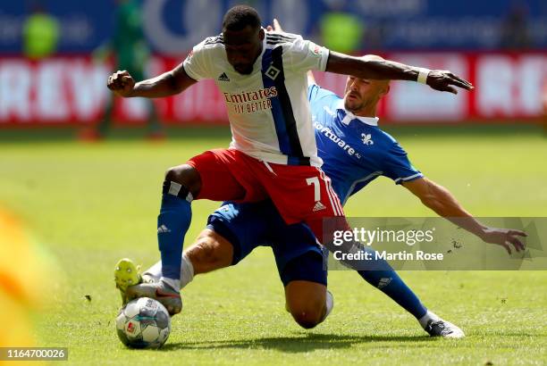 Khaled Narey of Hamburg challenges Patrick Herrmann of Darmstadt during the Second Bundesliga match between Hamburger SV and SV Darmstadt 98 at...