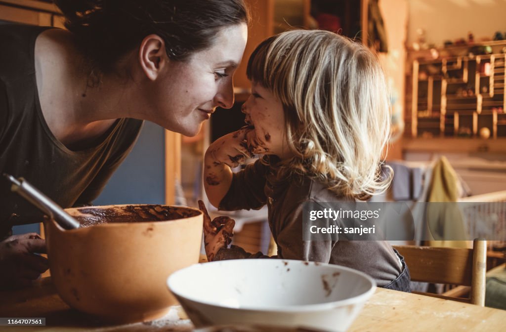 Toddler Making Cookies With His Mother