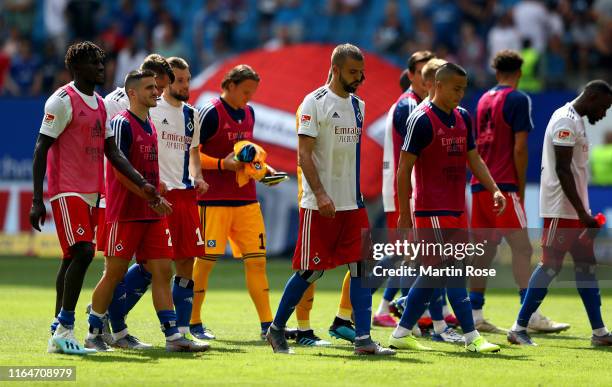 Players of Hamburg look dejected after the Second Bundesliga match between Hamburger SV and SV Darmstadt 98 at Volksparkstadion on July 28, 2019 in...