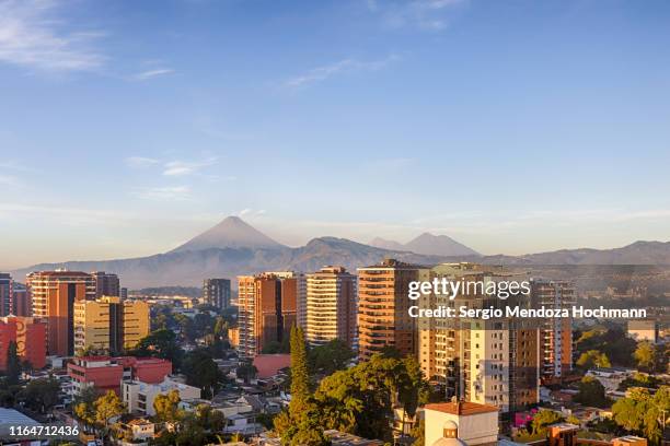 a panorama of guatemala city early in the morning - guatemala stock-fotos und bilder