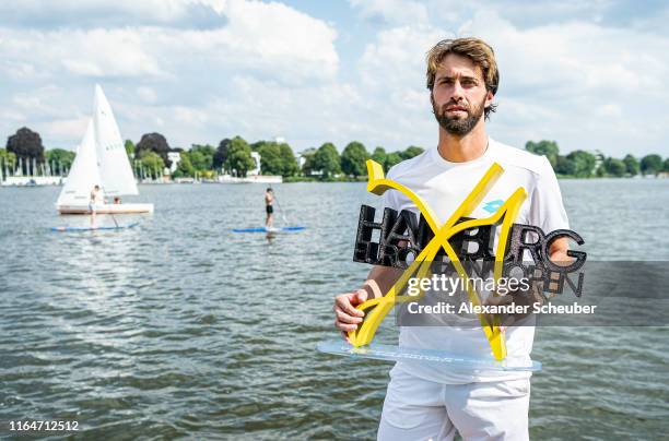 Winner Nikoloz Basilashvili of Georgia poses with the trophy during the Hamburg Open 2019 at Rothenbaum on July 28, 2019 in Hamburg, Germany.