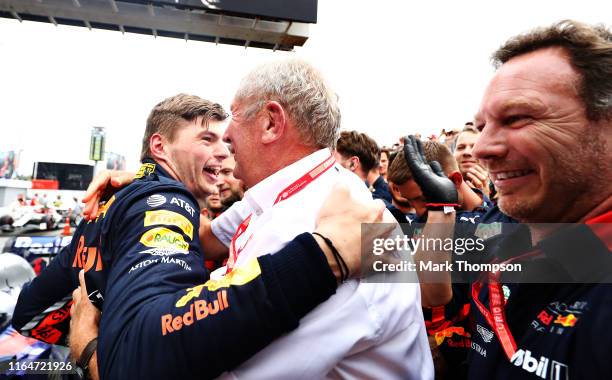 Race winner Max Verstappen of Netherlands and Red Bull Racing celebrates with Red Bull Racing Team Consultant Dr Helmut Marko in parc ferme during...