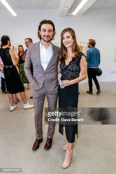 Alex Zane and Nettie Wakefield attend a private view of Nichole Fitch and Nettie Wakefield's new exhibition 'Painted Blind' at Soho Revue on August...