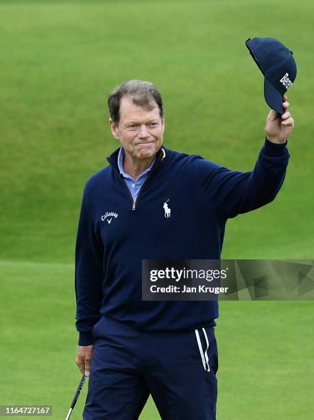 Tom Watson of United States of America walks onto the 18th green in his final apprearance at a Senior Open during the final round of the Senior Open...