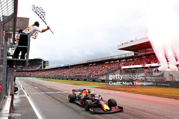 Race winner Max Verstappen of the Netherlands driving the Aston Martin Red Bull Racing RB15 takes the chequered flag and the win during the F1 Grand...