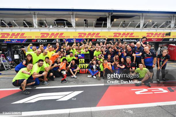Third placed Daniil Kvyat of Russia and Scuderia Toro Rosso celebrates with his team after the F1 Grand Prix of Germany at Hockenheimring on July 28,...