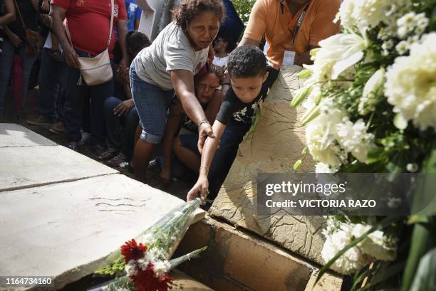 Relatives and friends attend the funeral of Erick Hernandez, DJ at the Caballo Blanco bar , at a cemetery in Coatzacoalcos, Veracruz State, Mexico,...