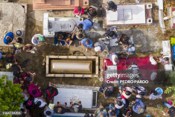 Relatives and friends attend the funeral of Erick Hernandez, DJ at the Caballo Blanco bar , at a cemetery in Coatzacoalcos, Veracruz State, Mexico,...