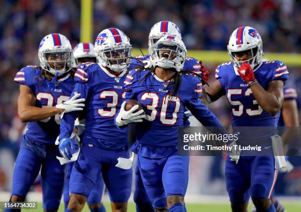Lafayette Pitts of the Buffalo Bills celebrates his interception with teammates in the first half of a preseason game against the Minnesota Vikings...