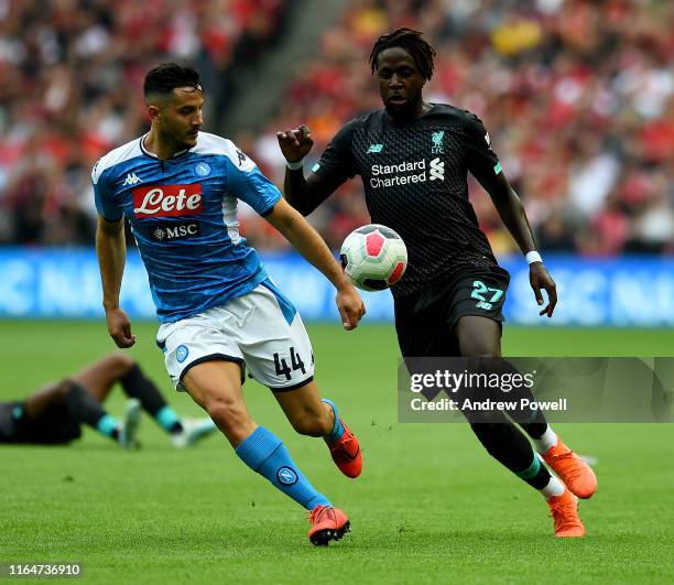 Divock Origi of Liverpool with Kostantinos Manolas of S.S.C. Napoli during the Pre-Season Friendly match between Liverpool FC and SSC Napoli at...