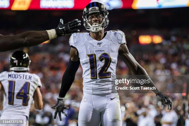 Jaleel Scott of the Baltimore Ravens celebrates after catching a pass for a touchdown against the Washington Redskins during the first half of a...