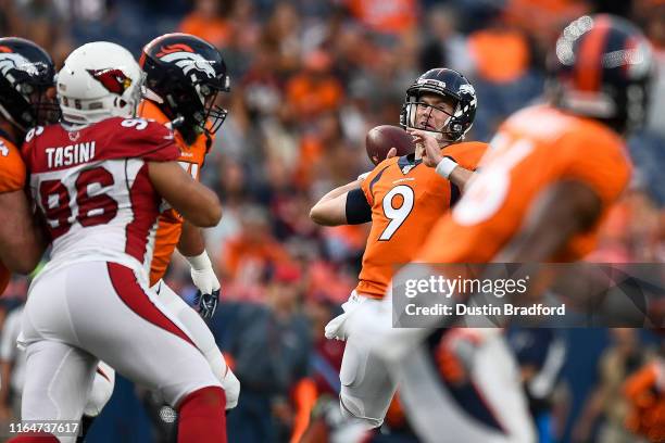 Kevin Hogan of the Denver Broncos passes against the Arizona Cardinals during the first quarter of a preseason National Football League game at...