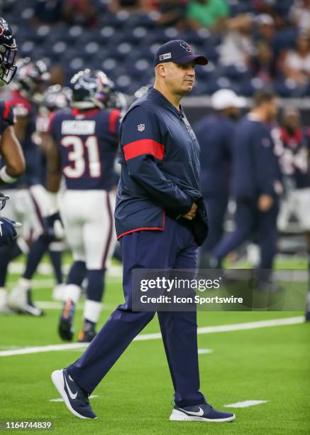 Houston Texans head coach Bill O'Brien warms up players during the football game between the Los Angeles Rams and Houston Texans at NRG Stadium on...