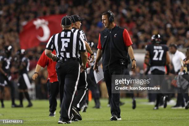 Cincinnati Bearcats head coach Luke Fickell talks with referees during the game against the UCLA Bruins and the Cincinnati Bearcats on August 29th...