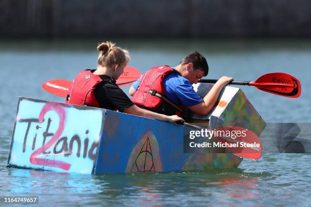 Titanic 2 makes its way round the course in the opening heat during the Bideford Cardboard Boat Regatta on July 28, 2019 in Bideford, England.