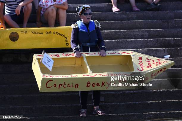 Rosie Smith waits for the second heat quayside with her boat HMS Beaky during the Bideford Cardboard Boat Regatta on July 28, 2019 in Bideford,...