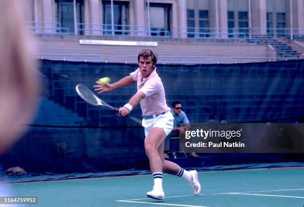 American tennis player Roscoe Tanner hits a backhand at a tennis tournament held at Soldier Field in Chicago, Illinois, 1976.