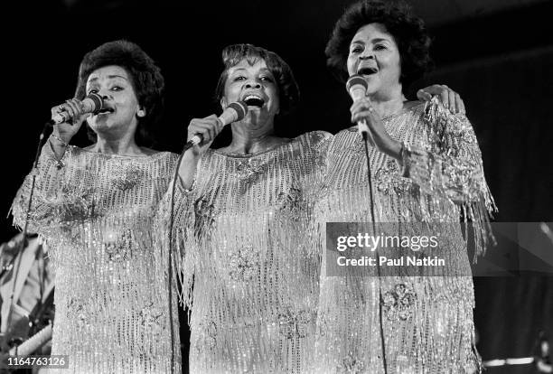 American Soul and Gospel group the Staples Singers perform onstage at the Petrillo Bandshell, Chicago, Illinois, June 8, 1986. Pictured, from left,...