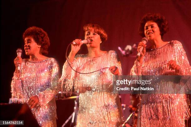 American Soul and Gospel group the Staples Singers perform onstage at the Petrillo Bandshell, Chicago, Illinois, June 8, 1986. Pictured, from left,...